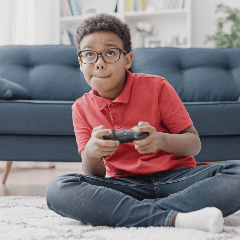 Image of a child playing video games on a console.