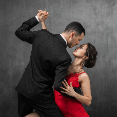 Image of a couple gracefully tango dancing with passion and elegance.